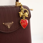 Coach Bow Heart Locket Bag Charm - Selsabil Shop